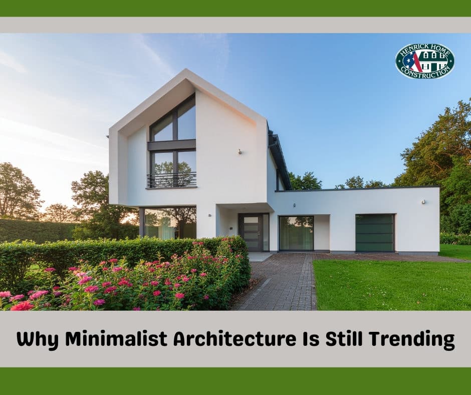 Minimalist modern home exterior with clean lines framed by mature trees on the property